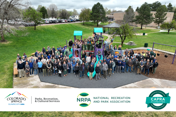 Group photo of PRCS employees at a park playground.