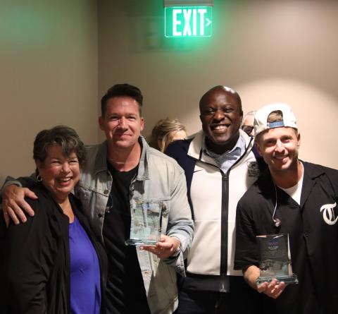 Mayor Yemi poses for a photo with Zach Filkins (left) and Ryan Tedder (right) of One Republic after presenting them with their Spirit of the Springs awards.