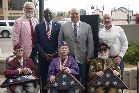 Mayor Yemi takes a photo in front of the City Administration Building with the recipients of the 2024 Flag Day Award veterans Edwin Black (WWII And Korean War), Walter Knight (WWII) and Melvin Postlewait (Korean War)
