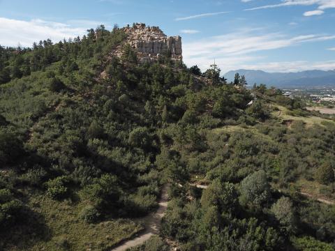 Photo looking southwest at Austin Bluffs Open Space. Pulpit Rock is visible in the background of the image.