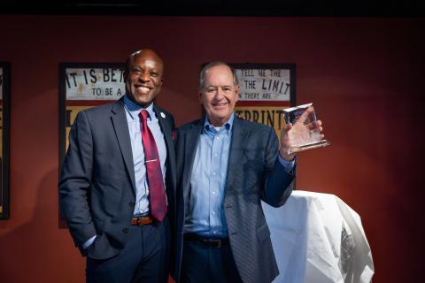 Mayor Yemi (left) and Martin Wood (right) with his Spirit of the Springs award in Clyde's Gastropub.