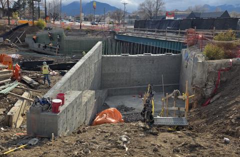 Wing walls under construction on the east side of the 8th Street bridge over Fountain Creek highlight the expanded width of the bridge, where a new northbound lane will be added.