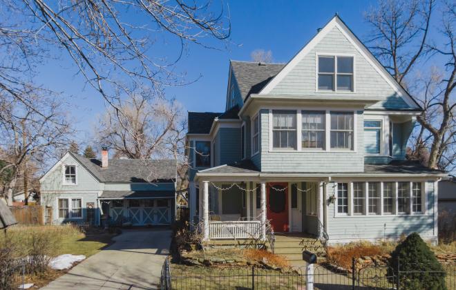 two story house with detached garage and auxiliary dwelling unit in back