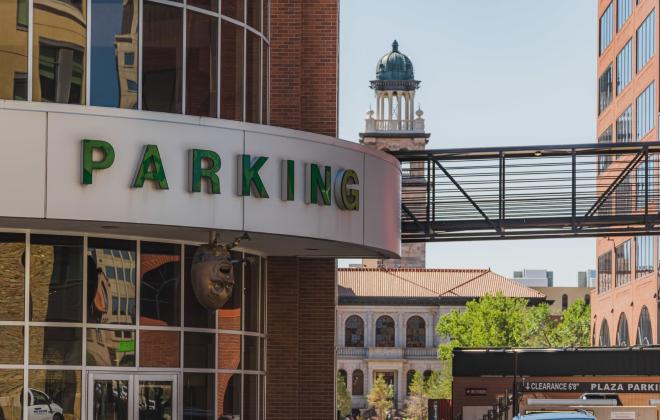 large parking sign on the garage downtown