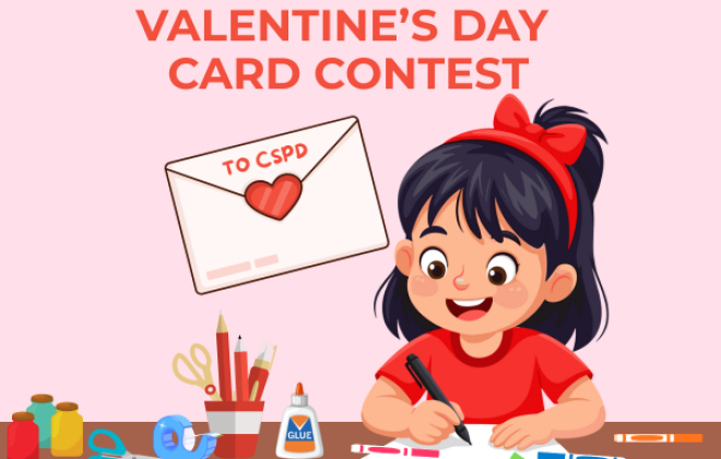 Valentines Day Card Contest. A little girl is making a handmade valentines day card for the contest. Various craft supplies are laying on the table. 