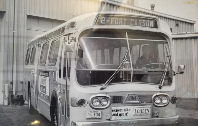 old black and white photo of a bus on route to Fort Carson